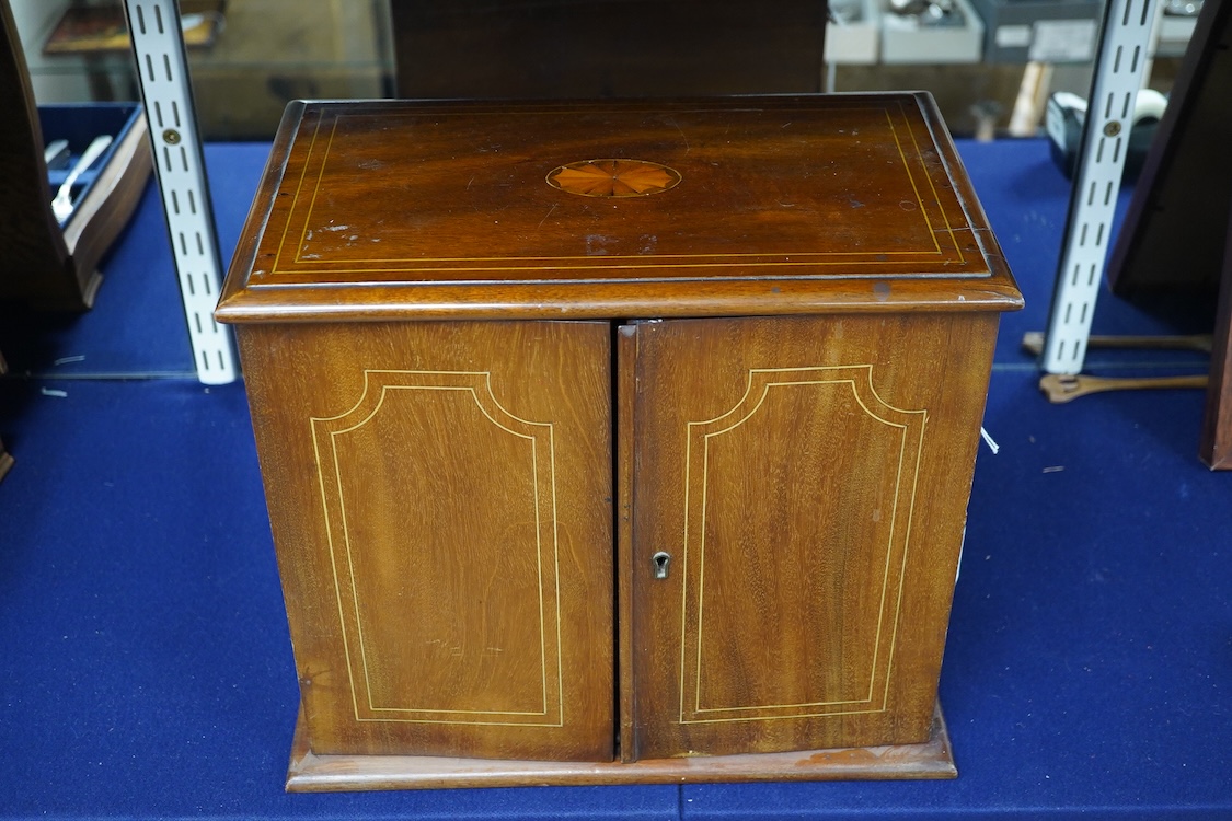 An Edwardian mahogany inlay two door smoker's cabinet, 30.5cm high, 35.5cm wide. Condition - fair